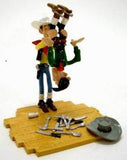 Lucky Luke secouant Averell par les pieds